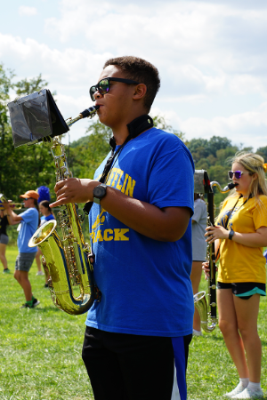 A West Mifflin saxophonist plays in formation during a marching band practice.