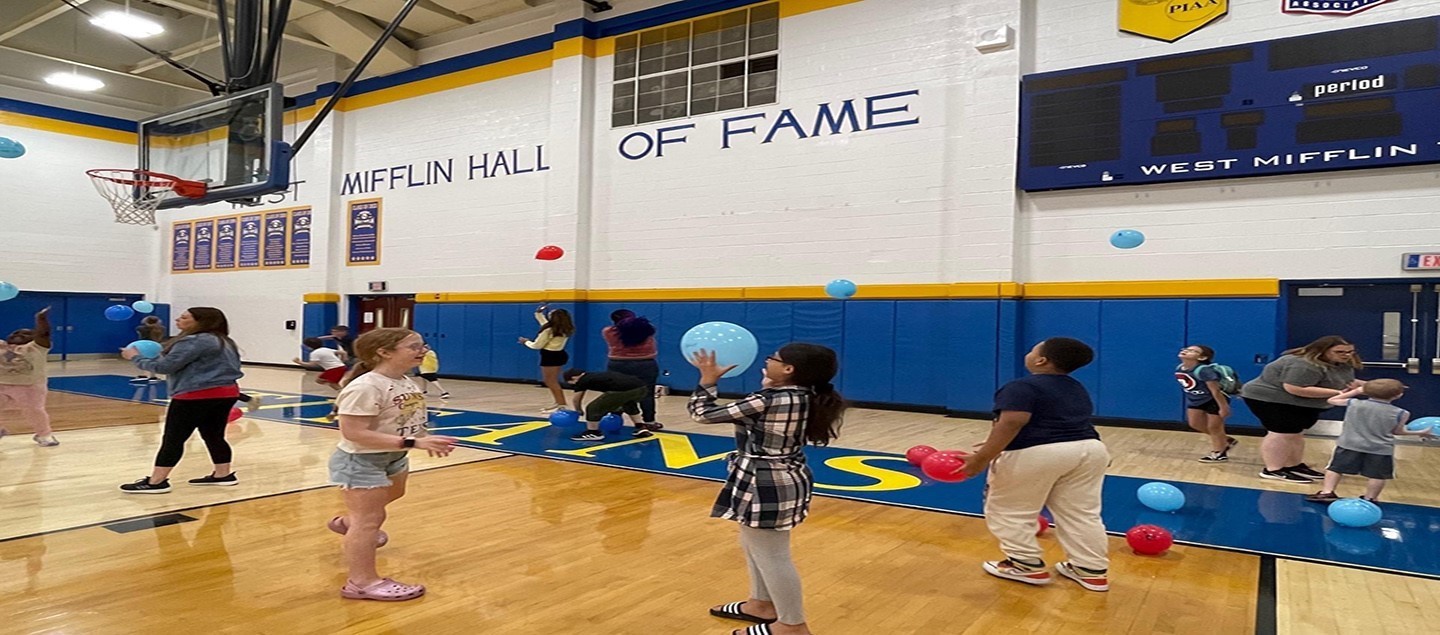 students with balloons